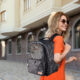 Beautiful young woman with stylish backpack outdoors. Space for text; Shutterstock ID 2017629293; purchase_order: -; job: -; client: -; other: -